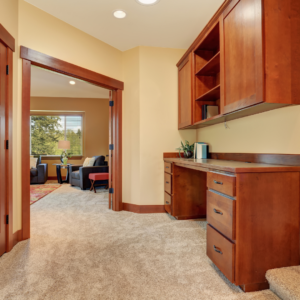 built in desk with overhead cabinets