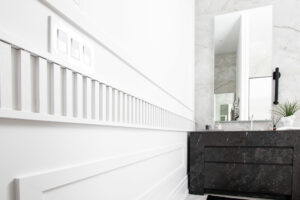 wall feature / wainscoting and sleek cabinetry in a bathroom