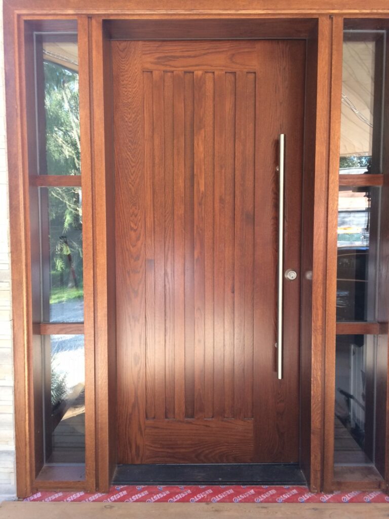 Oak entry door with sidelights and front door handle bar round