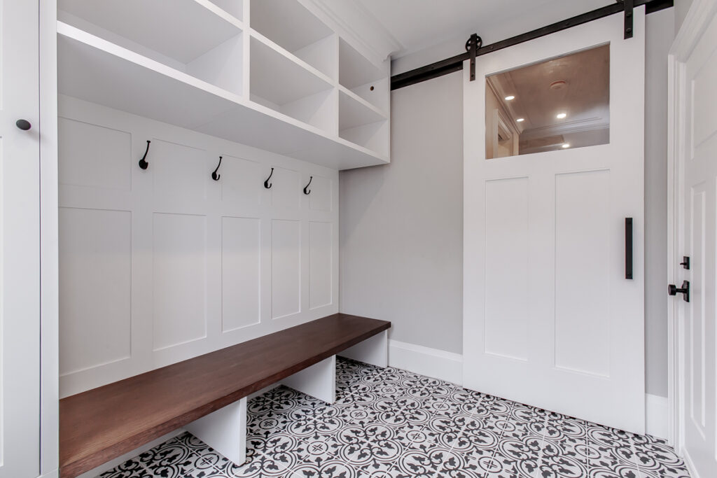 mudroom at garage entrance with barn door