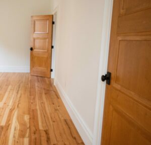 solid wood doors with matte black door knobs