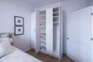 open closet in small bedroom 