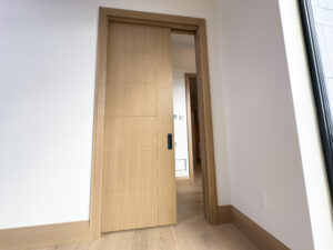 Custom wood oversized pocket door from our London Mill