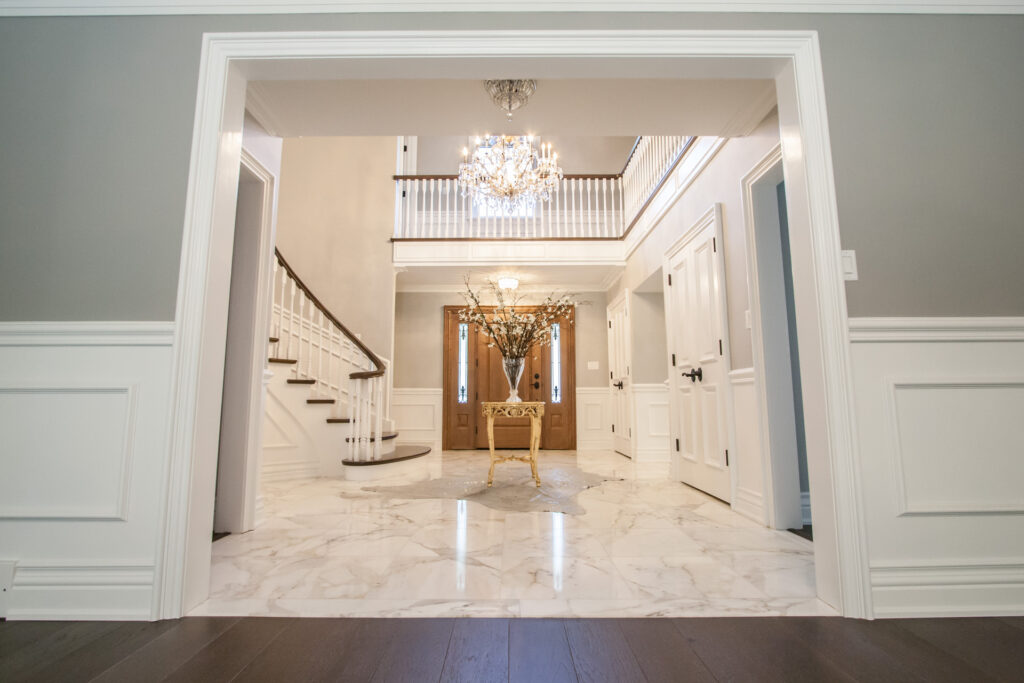 wainscoting on either side of door frame and in foyer